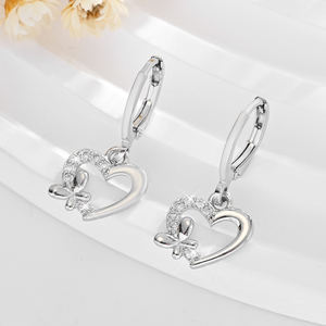 2025 alta calidad al por mayor arco corazón hueco 14K cobre chapado en oro incrustaciones de circón fiesta desgaste latón pendientes joyería de mujer - Product Image 2