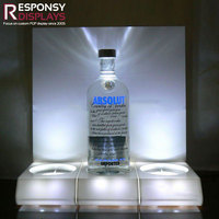 Présentoir d'alcool de comptoir en acrylique avec lumière LED pour support de vitrine de whisky Vodka dans le club de bar et le magasin de détail
