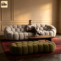 Ensemble de canapés modulaires ronds en tissu bouclé sur mesure, dossier en forme de biscuit, pour réception d'hôtel et salon de villa