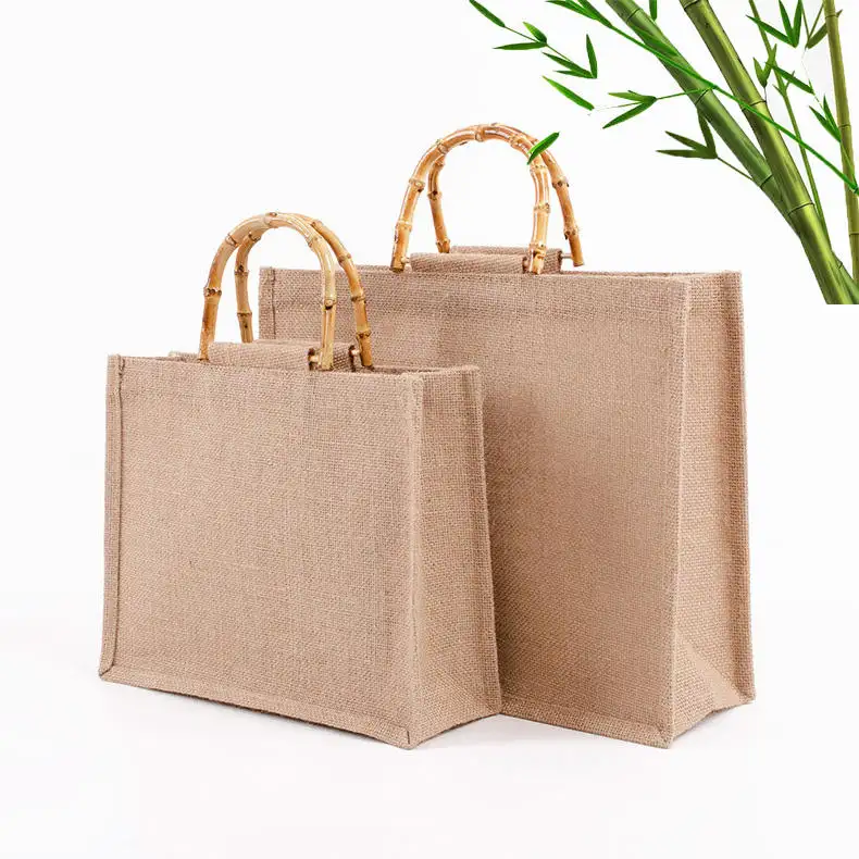 Yeniden kullanılabilir logo keten dayanıklı kapasiteli lamine çuval bezi 100% jüt alışveriş çantası hediye için bakkal alışveriş plaj bambu saplı