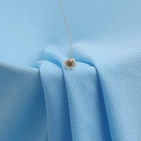 Tissu jersey en polyester à mailles œillets à séchage rapide pour vêtements de sport