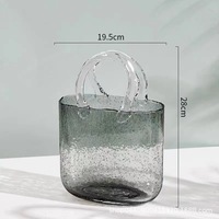 Petit vase à fleurs en verre hydroponique de luxe pour la décoration intérieure moderne Vase de sol en cristal borosilicate nordique de couleur claire en forme de sac à main