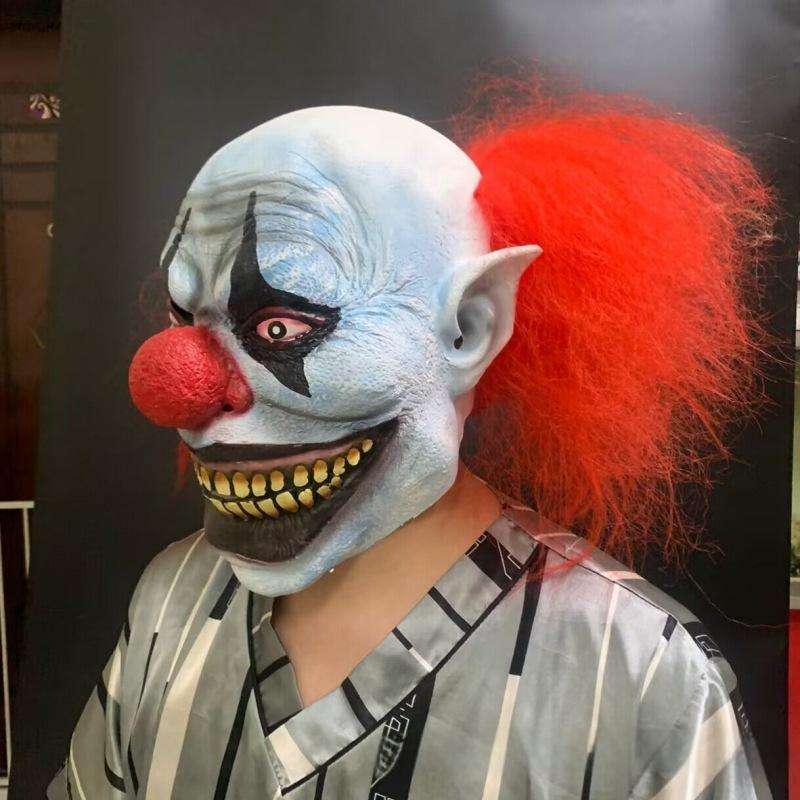 Red-haired and blue-faced clown