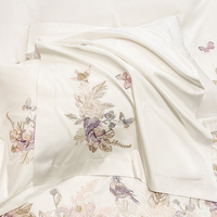 Ensemble de quatre pièces de draps, taies d'oreiller et housses de couette en coton à fibres longues brodées de fleurs