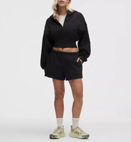 Ensemble de survêtement deux pièces pour femme, comprenant un sweat à capuche zippé oversize court et un short de survêtement assorti, en molleton doux, idéal pour la détente