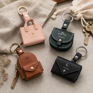 Porte-clés personnalisé en cuir PU, résistant aux UV et imperméable, avec logo en relief, design mini sac à main, idéal pour les promotions d'anniversaire, de mariage et de vacances - Product Image 1