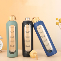Bouteille d'eau en verre de 1000ml Rappel de temps Citations Bouteilles d'eau réutilisables sans BPA avec manchon en silicone Couvercle en bambou