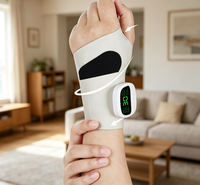 Attelle chauffante rechargeable pour poignet 2026 avec massage et soulagement de la douleur, thérapie par lumière rouge, enveloppement massant en plastique pour usage domestique
