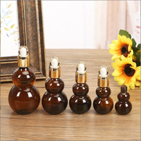 Bouteille en verre ambré en forme de gourde vide 10ml 20ml 30ml avec bouchon à vis pour les soins de la peau Offre Spéciale le récipient d'huile essentielle