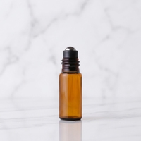 Vente en gros de flacons à bille en verre ambré de 10 ml avec bille en acier inoxydable, flacon d'huile essentielle de luxe, flacon à bille vide pour parfum
