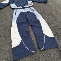 Ensemble de survêtement coupe-vent en nylon avec veste zippée à coutures personnalisées et pantalon ample en nylon, fabriqué sur mesure