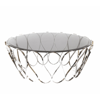 Table basse Aquarius avec plateau en verre fumé et base en acier inoxydable poli, design moderne élégant pour salon