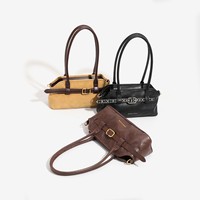 Sac coquille chic de style français pour l'automne/hiver 2026, rétro et polyvalent, à porter à l'épaule ou à la main, avec fermeture éclair et compartiment dissimulé pour téléphone portable