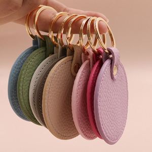 Stylish Colorful PU Leather Diaper Bag Keychain Round Leatherette Keychain Fashion Leather Round Keytag Logo Keychain <b>for</b> <b>Gifts</b> - Product Image 1