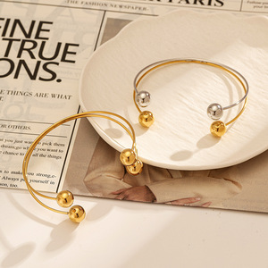 Bracelet en acier inoxydable bicolore or, design géométrique à double sphère, bijoux pour femmes - Product Image 1