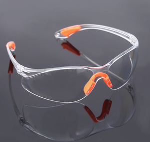 Lunettes de sécurité transparentes avec accents orange, monture en PVC durable pour la protection au travail - Product Image 2
