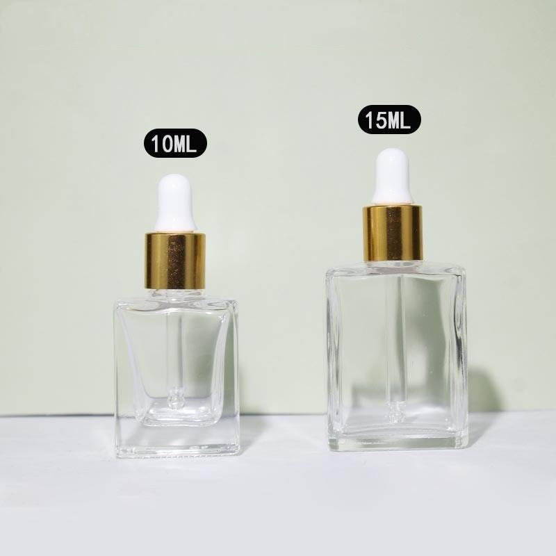 Clear with gold dropper head