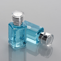 Flacon de parfum de luxe bleu rectangulaire 30ml 50ml 100ml avec impression sérigraphique, emballage cosmétique carré avec bouchon argenté