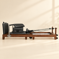 Machine de Pilates pliable en bois de chêne avec plateforme de saut et boîte d'assise pour studio commercial et salle de sport à domicile