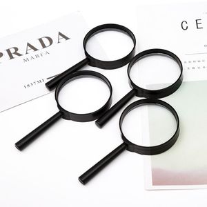 Lupa de mano de plástico de 5 cm para lectura y observación, uso juvenil - Product Image 1
