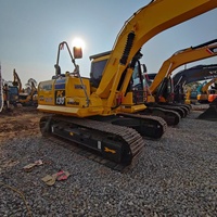 Excavatrice Komatsu PC130-7 d'occasion, modèle 2021, capacité de la benne de 0,5 m³, poids opérationnel de 13 tonnes, à vendre