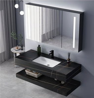 Meuble-lavabo mural en céramique intégré avec vasque en pierre frittée grise au design moderne, comptoir en pierre frittée pour usage hôtelier