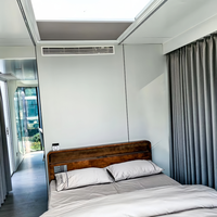Capsule de sommeil intelligente et mobile détachable, maison conteneur anti-humidité personnalisée au design moderne pour centres commerciaux et villas