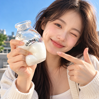 Vente en gros : Jouet anti-stress souple et transparent en forme de bouteille de lait, à remontée lente, jouet sensoriel à presser, cadeau personnalisé OEM