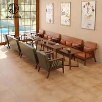 Ensemble de sièges de canapé de restaurant commercial moderne en bois ovale avec revêtement en cuir, table et chaise