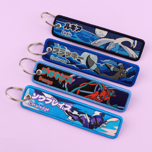 100 estilo Stock Pokemoned Anime bordado clave etiqueta Jet bordado tela tejido cordón llavero para llavero de moda - Product Image 2