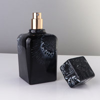 Flacon pulvérisateur de parfum de luxe personnalisé de 60 ml en verre noir premium avec bouchon supérieur carré en résine