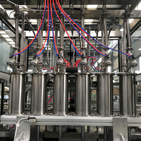 Ligne de remplissage entièrement automatique haute performance et haute compatibilité, adaptée aux bouteilles en verre et en plastique et aux divers liquides