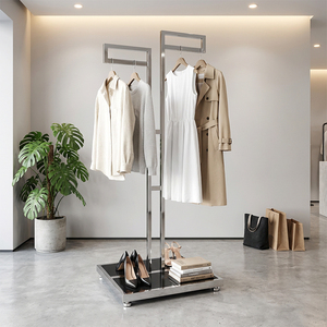 Support de présentation de vêtements en métal robuste au design minimaliste avec base en marbre pour l'aménagement de magasins de détail - Product Image 1