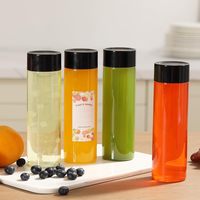 Ronda 350ml 500ml Botella desechable Leche Té Bebida Botella cilíndrica Jugo Botella de agua de plástico con tapón de rosca