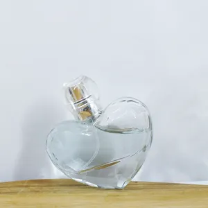 Botella de perfume transparente y popular de lujo, minibotella de perfume de 30ml, con tapa