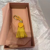 Pendentif de sac de luxe en forme de fleur, porte-clés en corde, breloques et accessoires en cuir pour sac