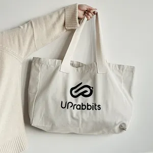 حقيبة قماشية من القطن العضوي بمقبض كبير مخصص للتسوق على الشاطئ حقيبة بيضاء بحزام شعار مخصص مطبوع