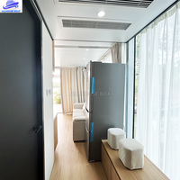 Maison flottante préfabriquée en aluminium, villa modulaire pour les vacances en famille, les séjours en hôtel et les locations de villas.