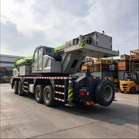 Grue sur camion d'occasion de 100 tonnes, flèche de 60,5 m, contrepoids total de 23,5 t, châssis 8x4 de classe G pour l'exploitation minière et les champs pétrolifères