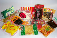 Machine de remplissage et d'emballage rotative sous vide pour sachets préformés de snacks de fruits de mer, à commande PLC automatique, de Wenzhou, Chine