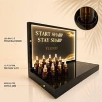 Présentoir portable moderne rétroéclairé par LED à 12 positions en acrylique pour huiles essentielles et sérums, support détachable noir brillant pour magasins de cosmétiques
