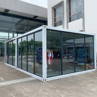Conteneur préfabriqué détachable Salle d'exposition Petite structure en acier Hall d'exposition Magasin de rue Cabine en verre Sunshine