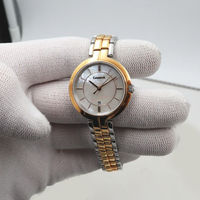 Montre à quartz pour femme, petite et élégante, en acier inoxydable, T094, aiguilles lumineuses, cadran or rose 26 mm, étanche