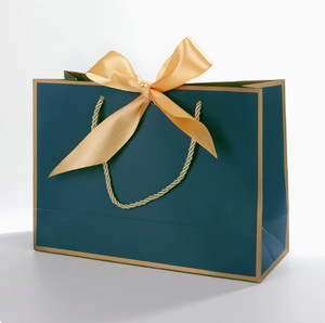 Bolsa de Papel Kraft Azul Marino con Diseño Floral y Logotipo Personalizado, Bolsa de Regalo con Asa y Cinta Dorada - Product Image 1