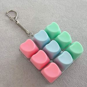 พวงกุญแจรูปปุ่มกดแบบกลไก 9 in 1 Heart White Base Decompression ของเล่นขนาดเล็กสำหรับแขวนกระเป๋าเป้ - Product Image 2