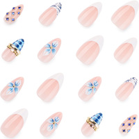 Vente en gros de faux ongles bleus à motifs floraux |   Base nude personnalisable avec imprimé zèbre et strass bleus, faux ongles élégants réutilisables