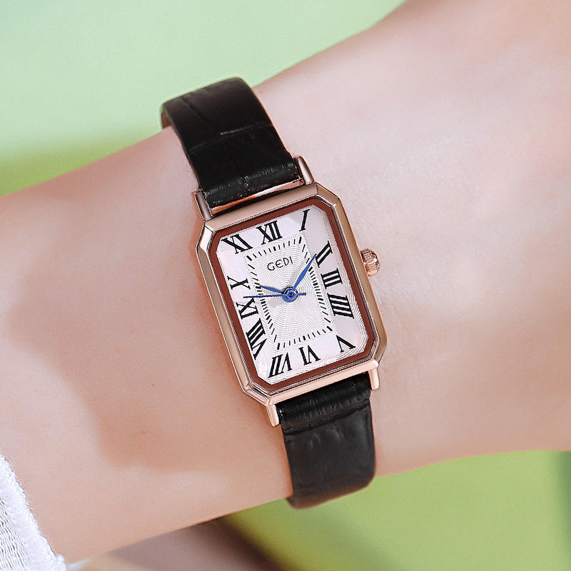 Rose gold shell, white plate, black band