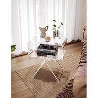 Table d'appoint en acrylique transparent, design à pieds croisés, pour lieux de prise de parole, avec étagère de rangement pour tasses à café et livres, style minimaliste pour la maison