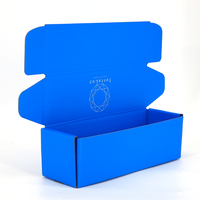 Caja de Cartón Corrugado con Lámina Azul Personalizada para Camisetas, Embalaje para Envío de Ropa, Proveedor Especializado en Embalaje Personalizado para Marcas de Ropa