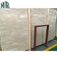 Prix direct usine – Carrelage de luxe en marbre beige royal d'Oman poli sur mesure pour la décoration murale des hôtels et villas de prestige